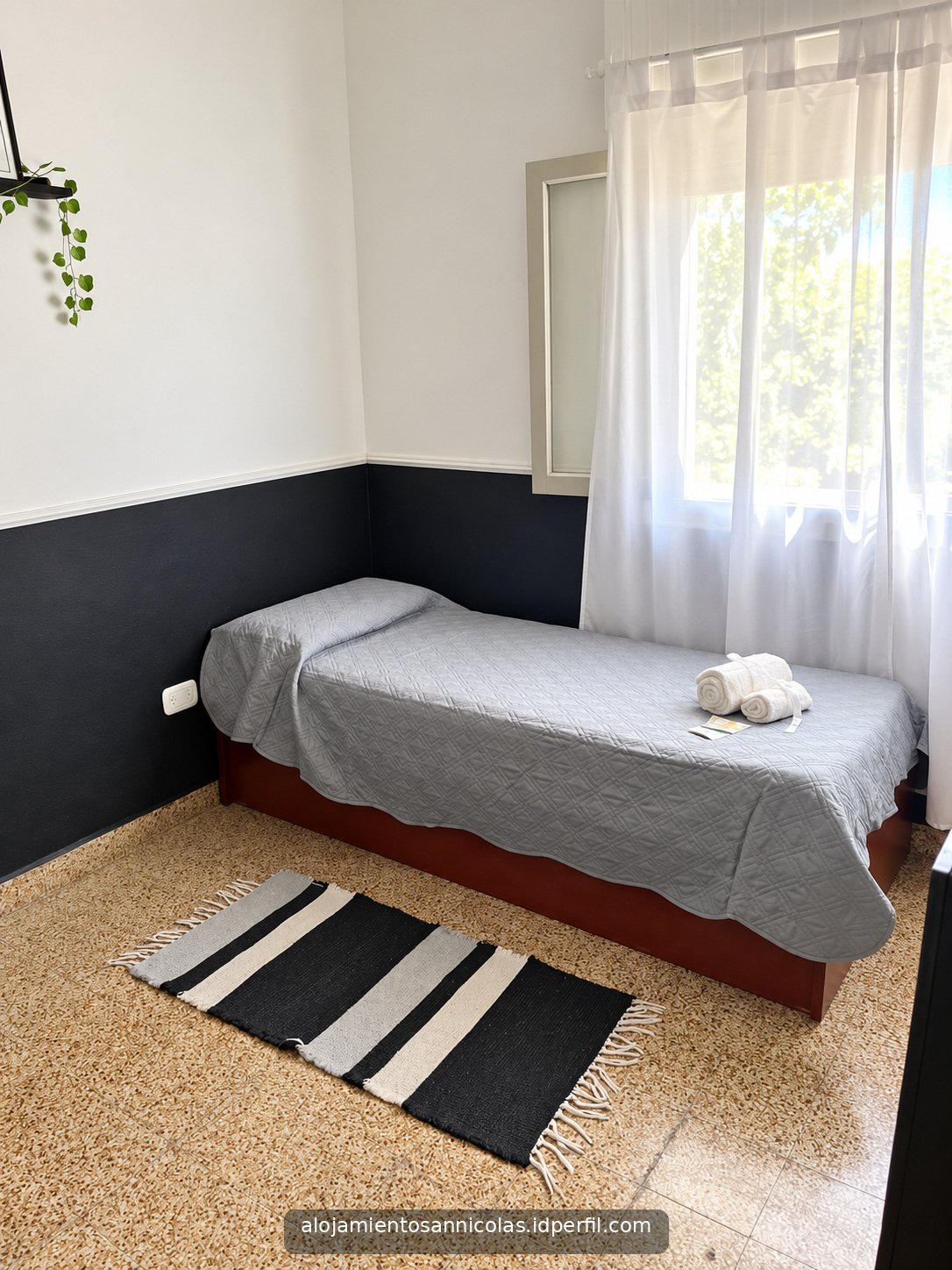 Cama individual en el segundo dormitorio